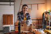 Woman working on a wooden project in a workshop